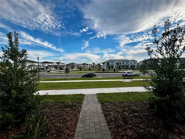 a view of a swimming pool with an outdoor seating yard and mountain view