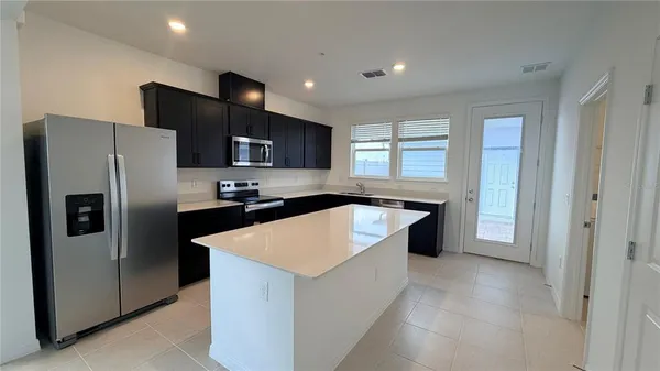 a view of swimming pool is middle and garden