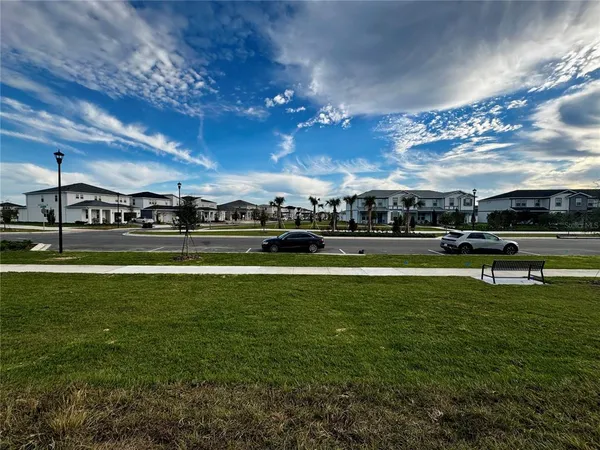 a kitchen with stainless steel appliances a stove a sink a microwave a refrigerator and cabinets