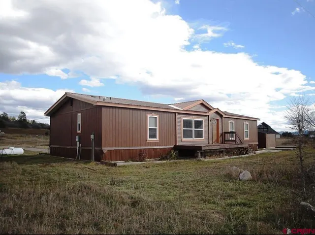 a house with trees in front of it