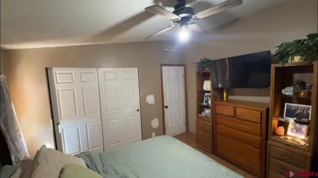 a bathroom with a sink vanity mirror and toilet