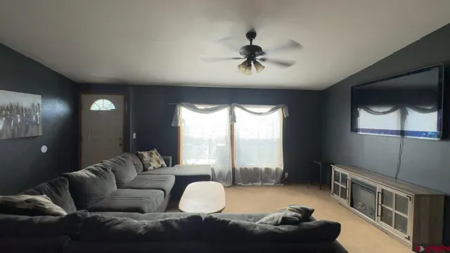 a living room with furniture and a window