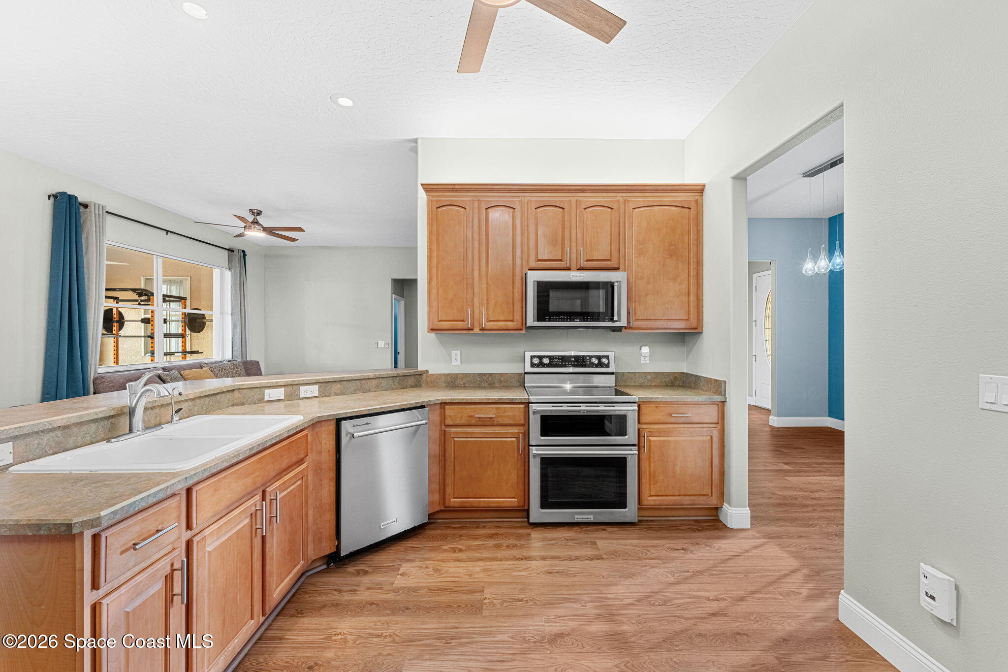1305 Pemberton Trail Malabar, FL 32950 - Photo 17 of 69 a kitchen with stainless steel appliances granite countertop a stove top oven a sink and dishwasher