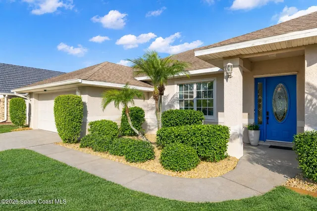 a kitchen with stainless steel appliances granite countertop a sink refrigerator stove and microwave