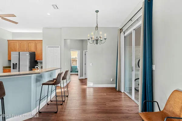 a view of a house with backyard and garden