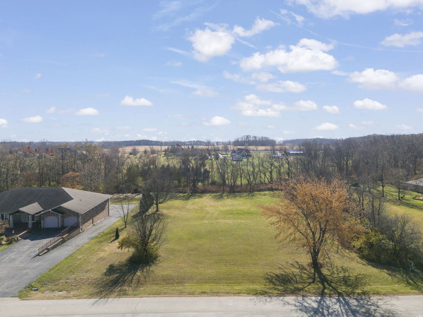 5147 West Jason Drive Monee, IL 60449 - Photo 5 of 15 a view of a swimming pool with a yard and mountain view
