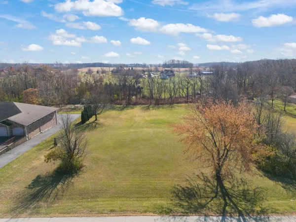 a view of a lake with a yard