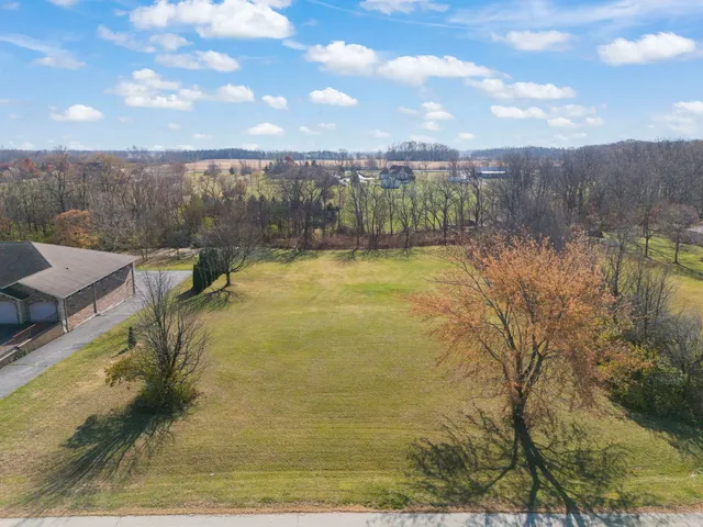 a view of a lake with a yard