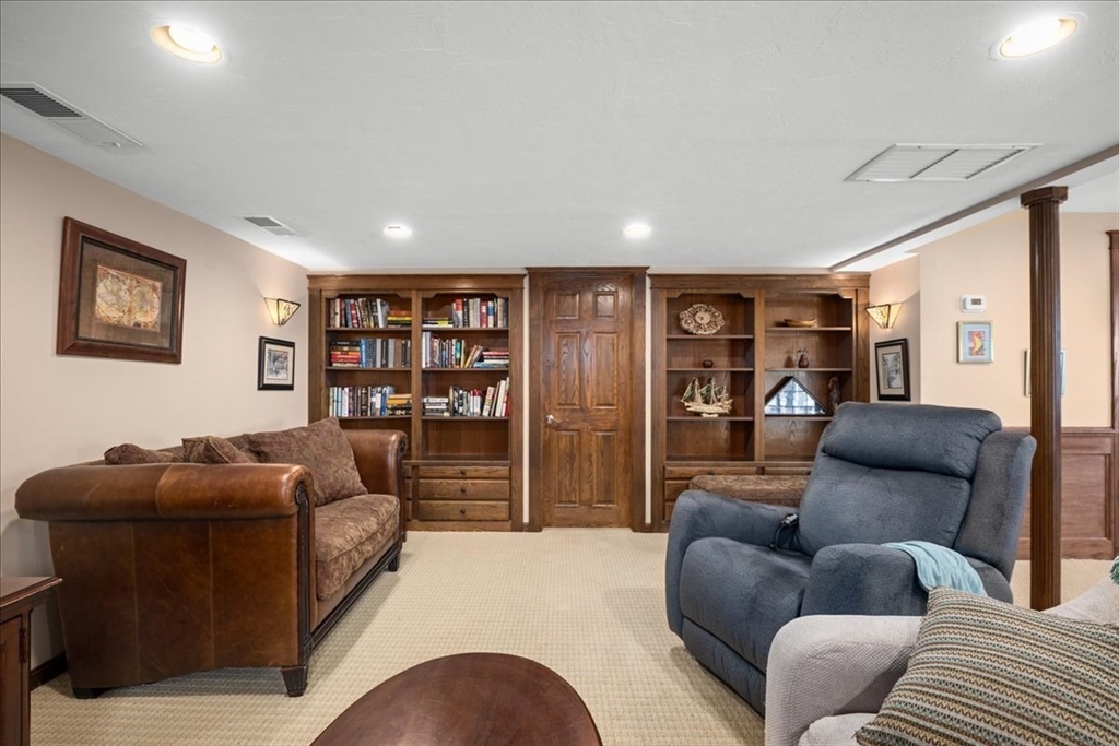 7 Primmett Lane, Unit 7 Worcester, MA 01609 - Photo 31 of 38 a living room with furniture and a couch