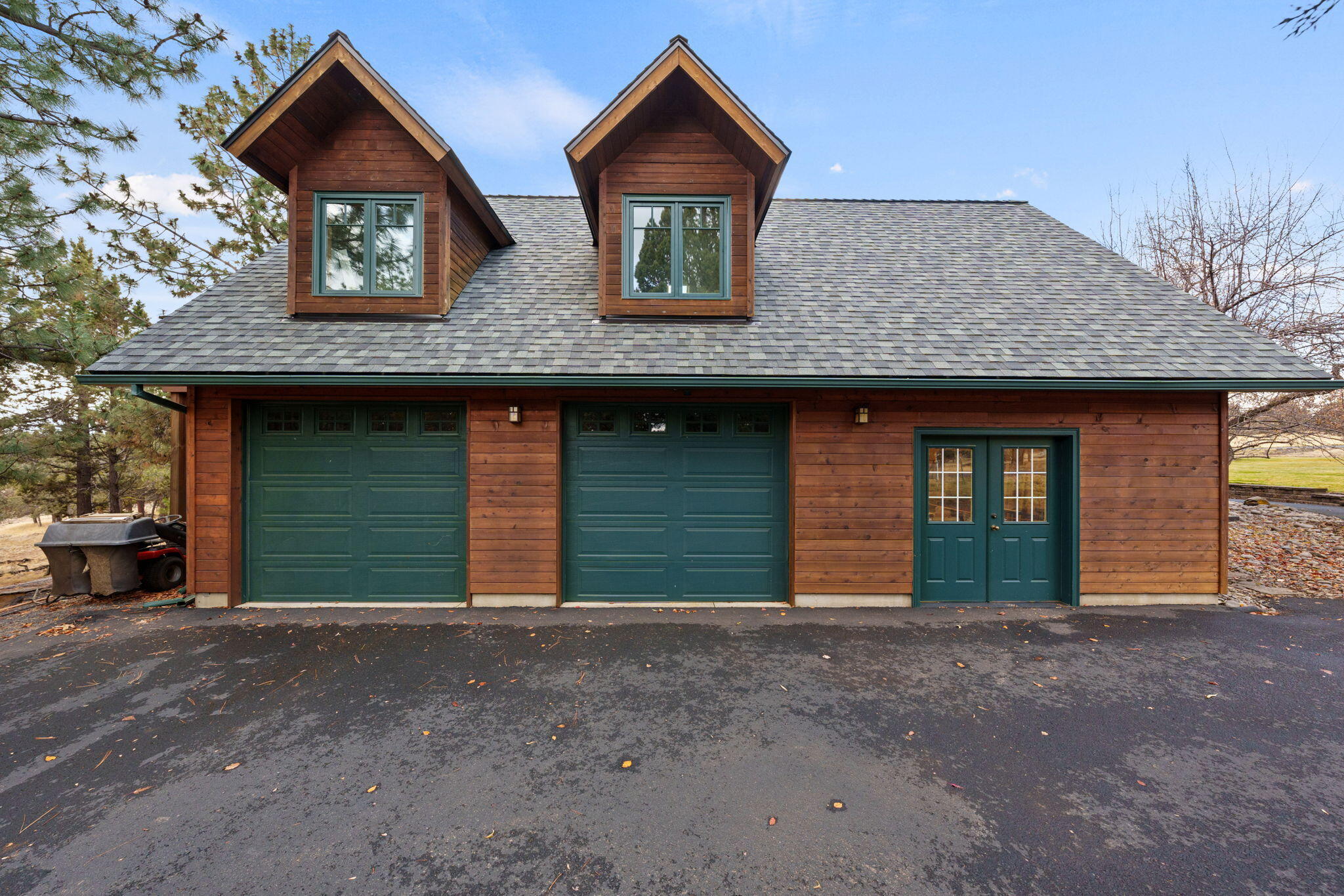 16045 Fox Ridge Circle Sisters, OR 97759 - Photo 19 of 40 2 car garage with adjacent workshop in 3rd bay and artist loft above16045 Fox Ridge Circle, Sisters, OR 97759