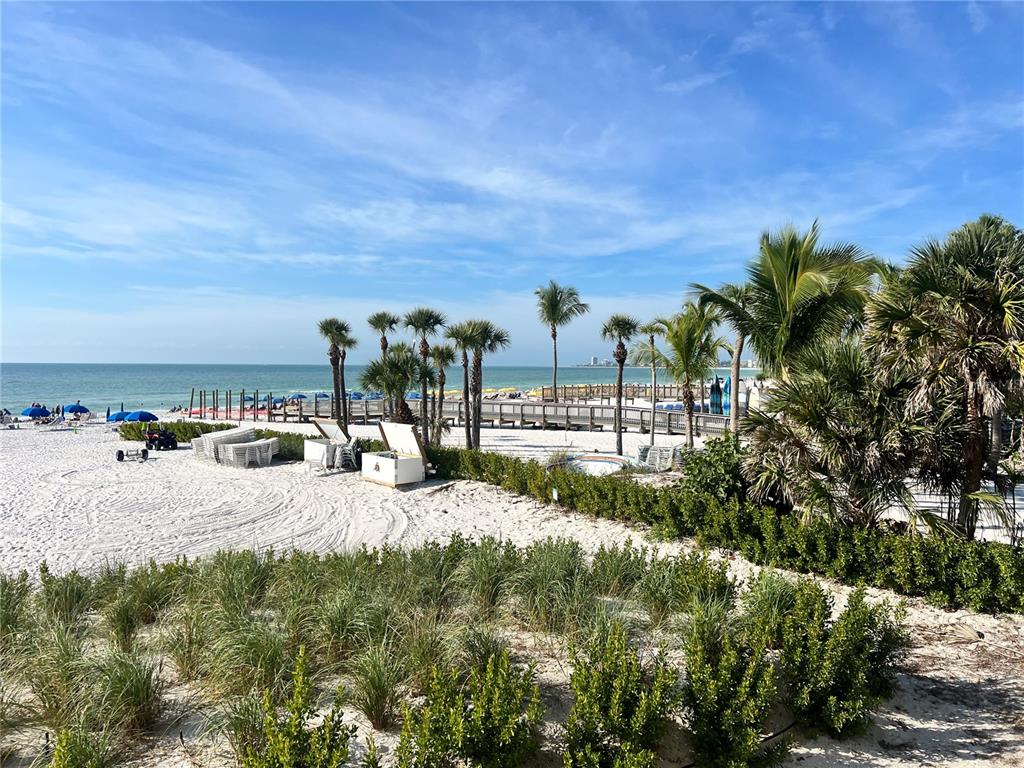 1001 Point Of Rocks Road, Unit 212 Sarasota, FL 34242 - Photo 16 of 36 a view of a house with a yard and sitting area