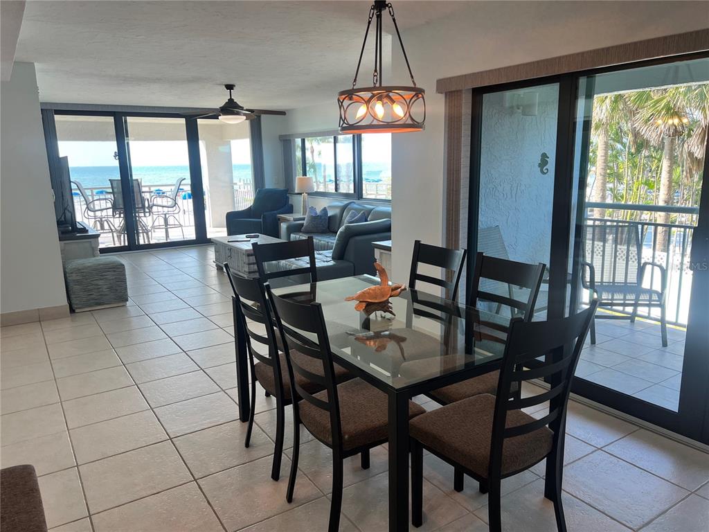 1001 Point Of Rocks Road, Unit 212 Sarasota, FL 34242 - Photo 2 of 36 a view of a dining room with furniture window and outside view