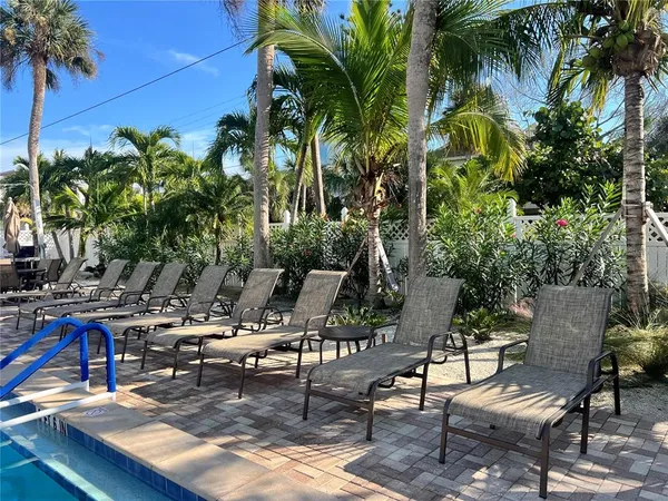 a view of outdoor kitchen with seating area
