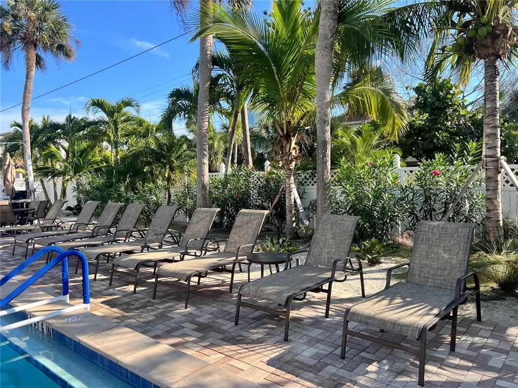 1001 Point Of Rocks Road, Unit 212 Sarasota, FL 34242 - Photo 25 of 36 a view of a swimming pool with chairs