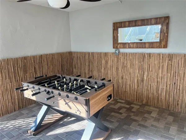 a view of a room with wooden floor and windows