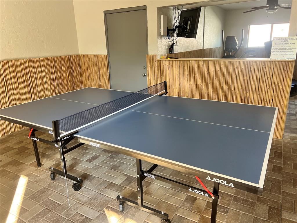 1001 Point Of Rocks Road, Unit 212 Sarasota, FL 34242 - Photo 29 of 36 a view of a room with wooden floor and windows