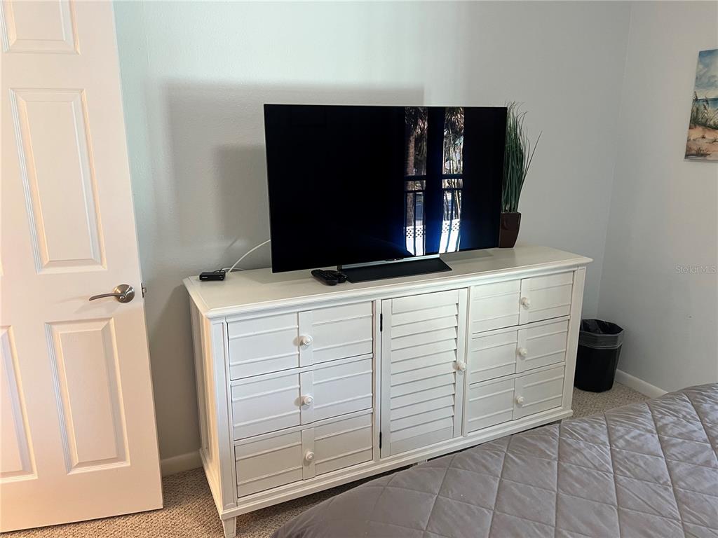 1001 Point Of Rocks Road, Unit 212 Sarasota, FL 34242 - Photo 6 of 36 a bathroom with a sink and a mirror