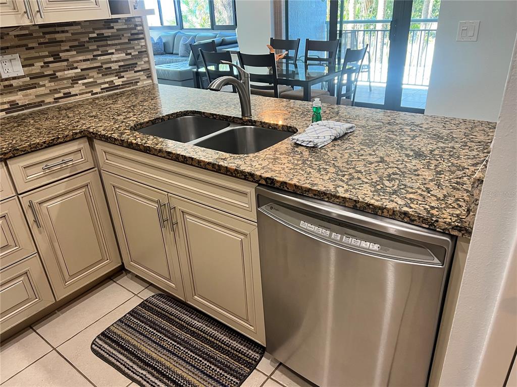 1001 Point Of Rocks Road, Unit 212 Sarasota, FL 34242 - Photo 8 of 36 a view of a kitchen sink