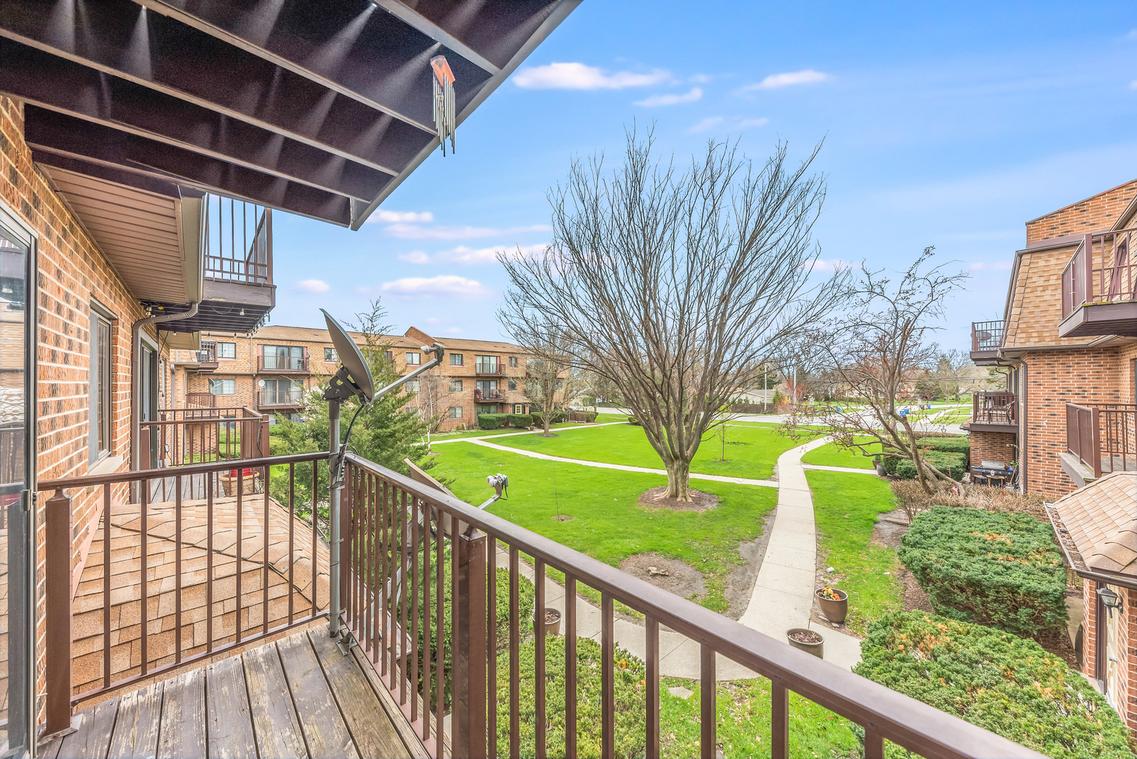 404 East Kensington Road, Unit C Mount Prospect, IL 60056 - Photo 14 of 16 a view of a porch and a yard