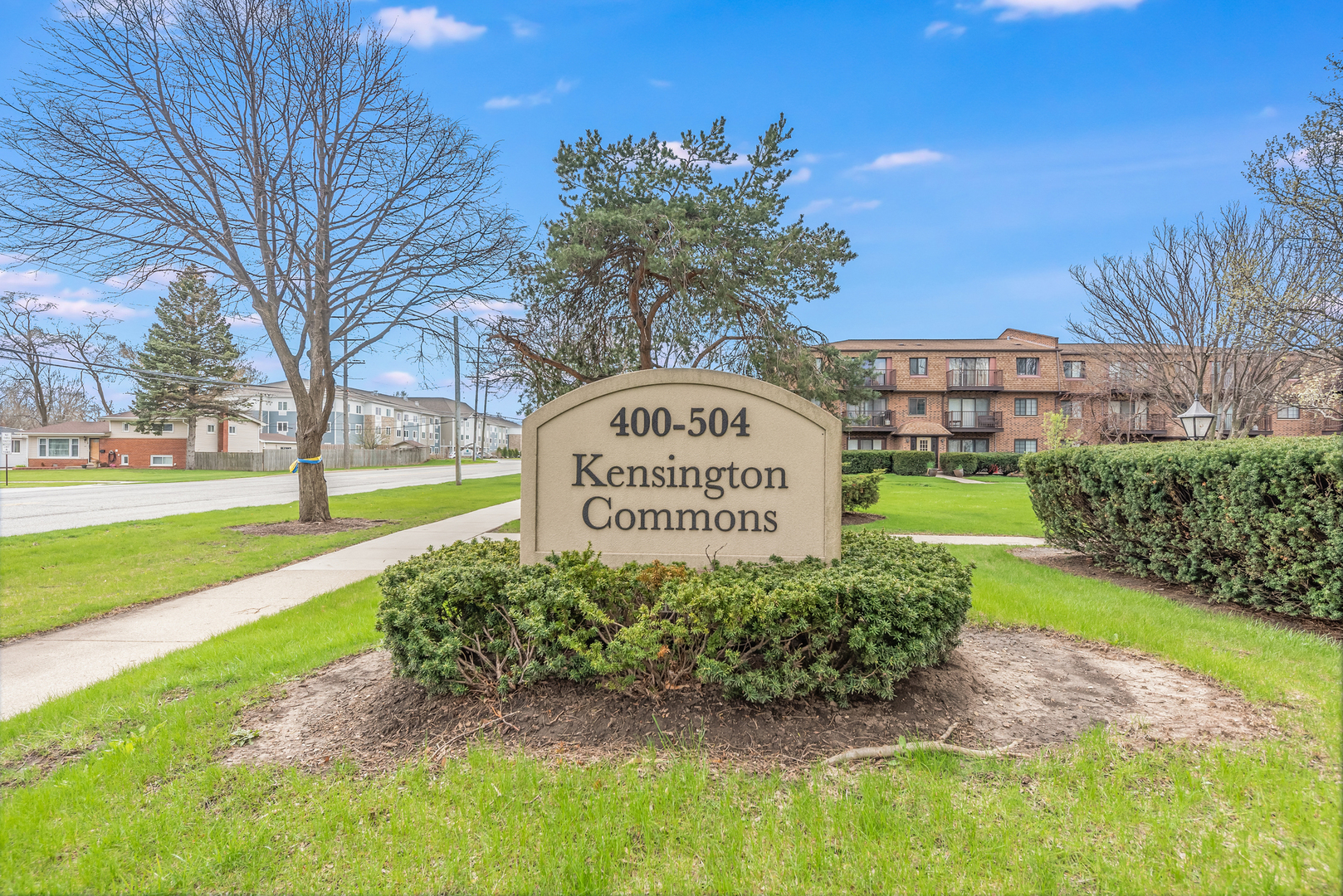 404 East Kensington Road, Unit C Mount Prospect, IL 60056 - Photo 2 of 16 a sign on the side of the road