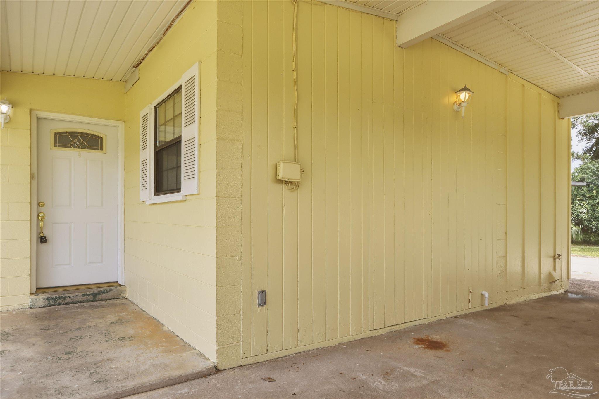 101 Vanderbilt Road Pensacola, FL 32506 - Photo 5 of 33 2-car carport with side entry door