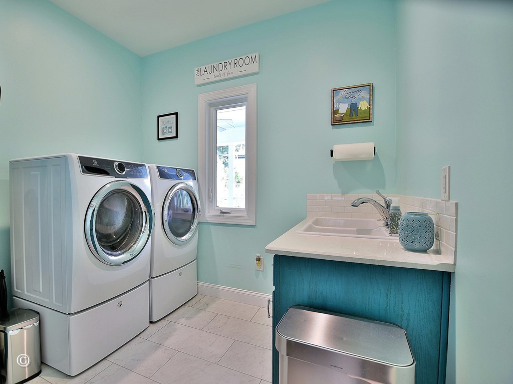 161 Layfield Branch Road Hamilton, GA 31811 - Photo 31 of 59 Laundry with washing sink and storage