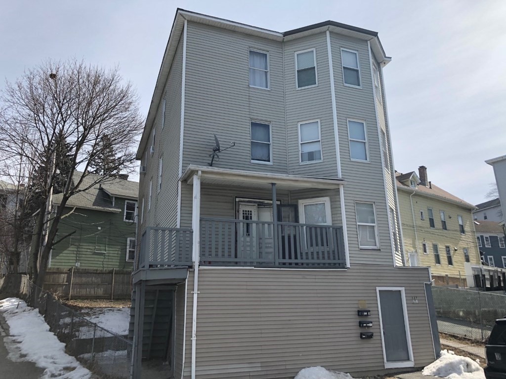 137 Eastern Worcester, MA 01605 - Photo 2 of 15 a front view of a building with a yard