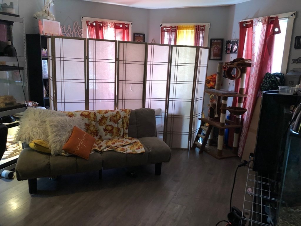 137 Eastern Worcester, MA 01605 - Photo 6 of 15 a living room with furniture a window and bookshelf