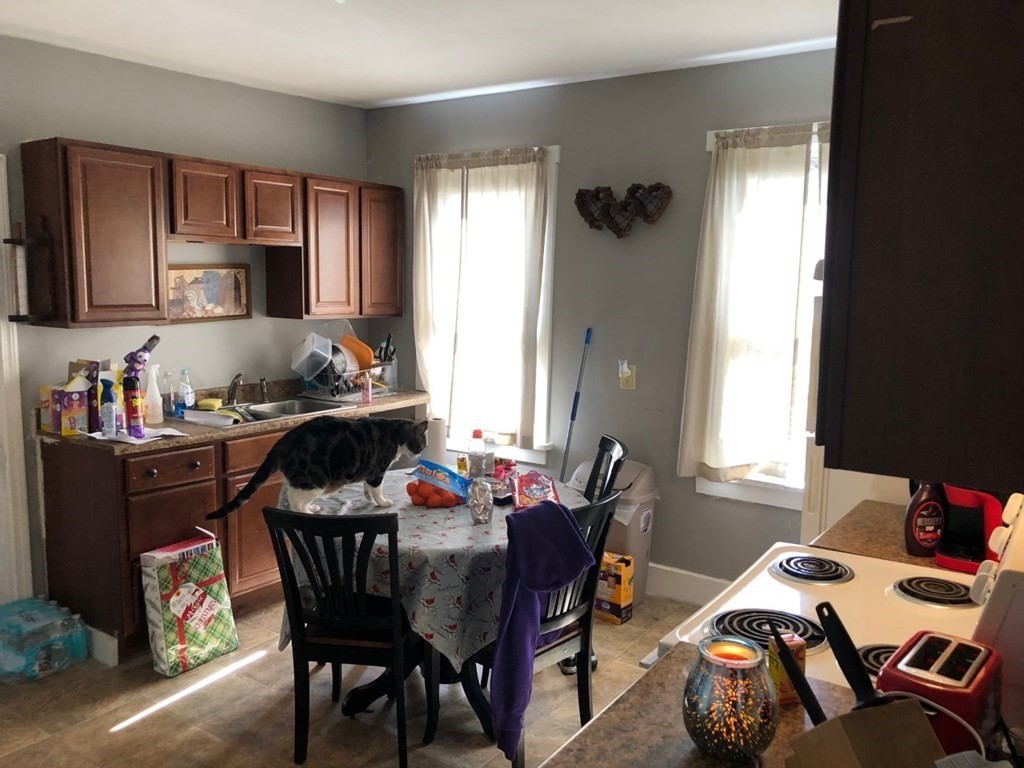 137 Eastern Worcester, MA 01605 - Photo 8 of 15 a view of a dining room with furniture and a window
