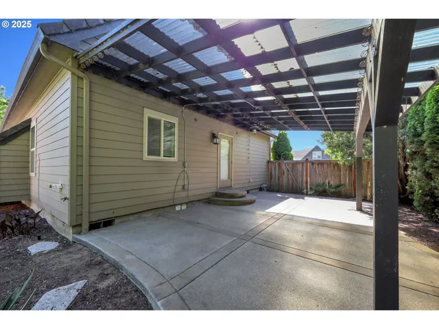 a view of a backyard of the house