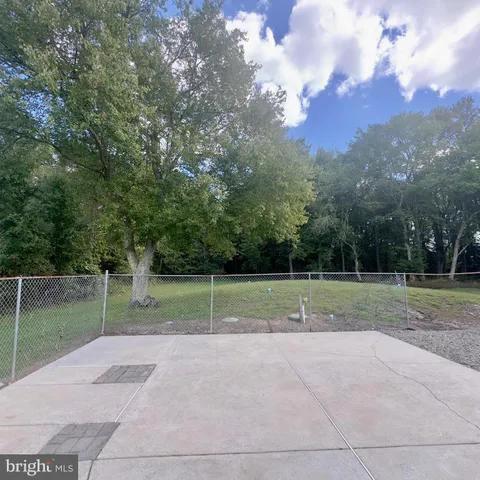 a view of front of house with a yard