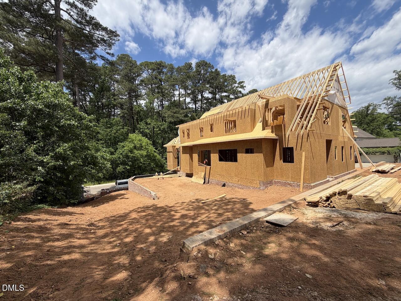 2123 Dunhill Drive Raleigh, NC 27608 - Photo 6 of 10 a view of a house with a yard