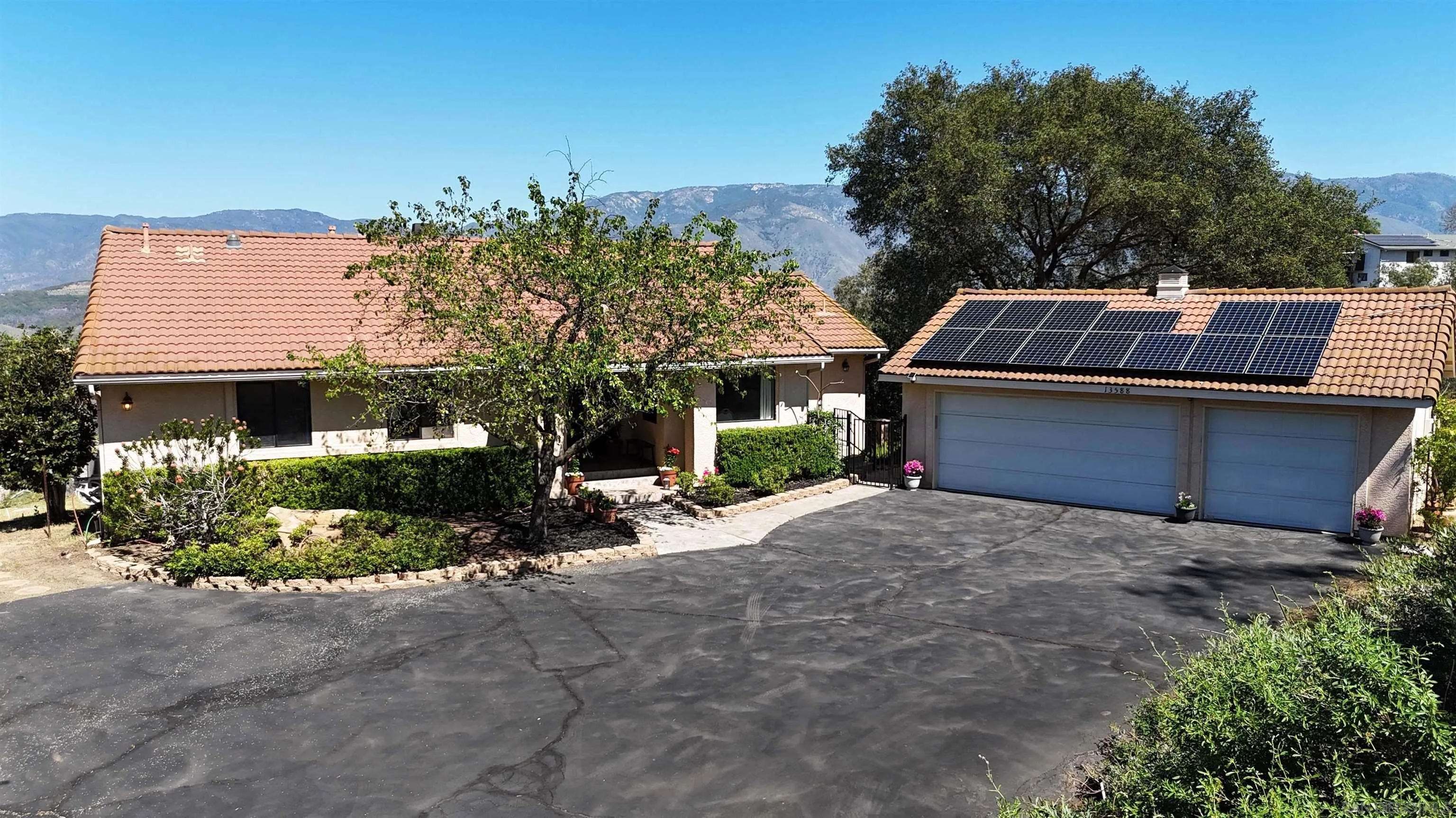 13588 McNally Road Valley Center, CA 92082 - Photo 34 of 43 a front view of a house with a yard