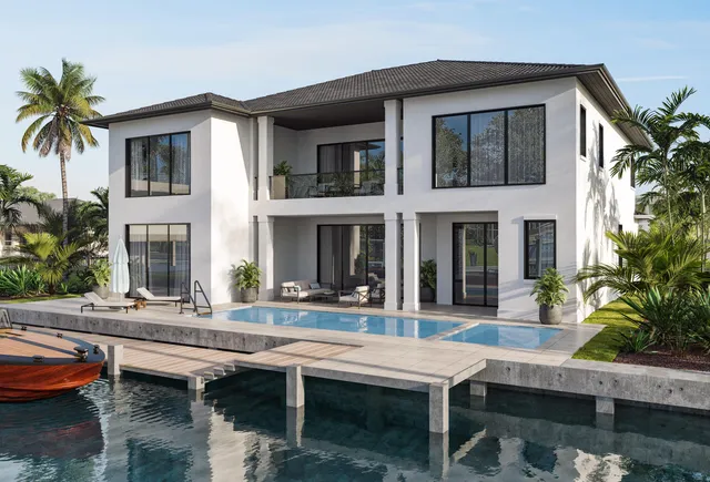 a house that has a table and chairs in patio