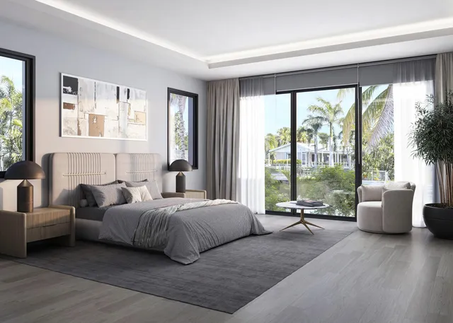 a bedroom with a large bed and a large window