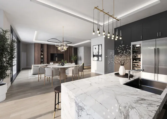 a dining hall with a dining table a chandelier and refrigerator