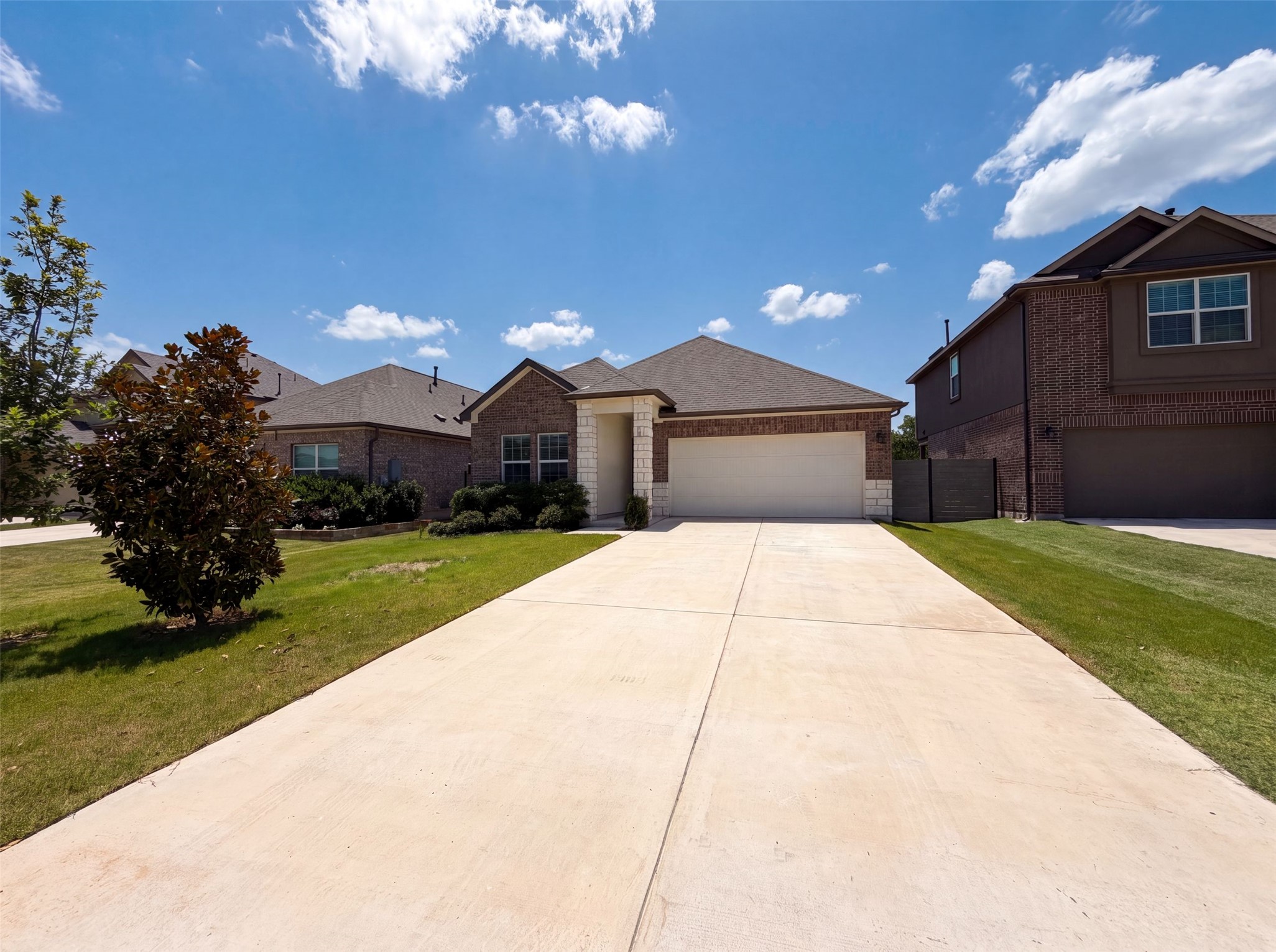 424 Wolf Springs Road Georgetown, TX 78628 - Photo 14 of 15 A welcoming facade with brick and stone accents creates inviting curb appeal.