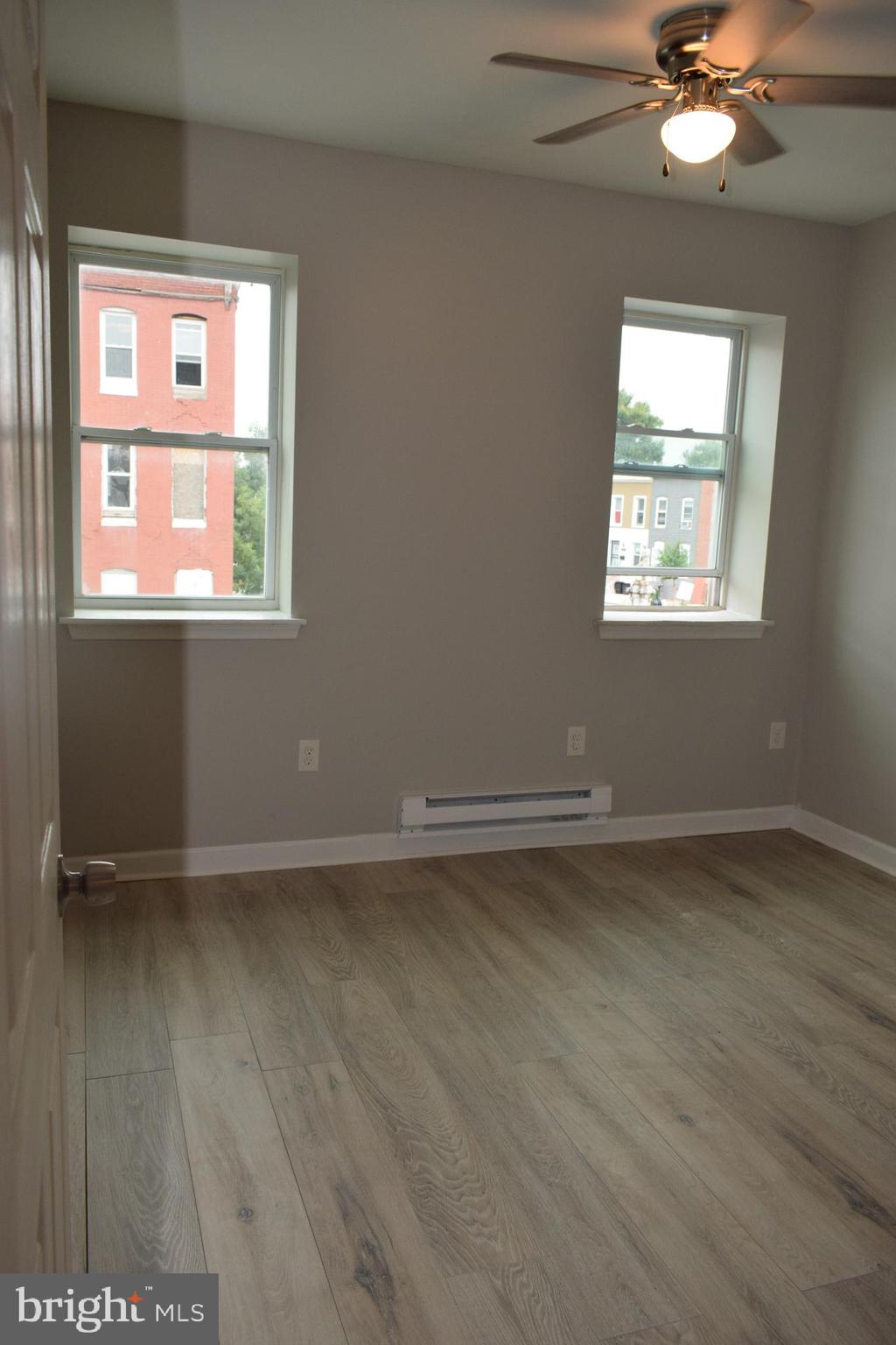 346 South Payson Street Baltimore, MD 21223 - Photo 14 of 29 an empty room with a window