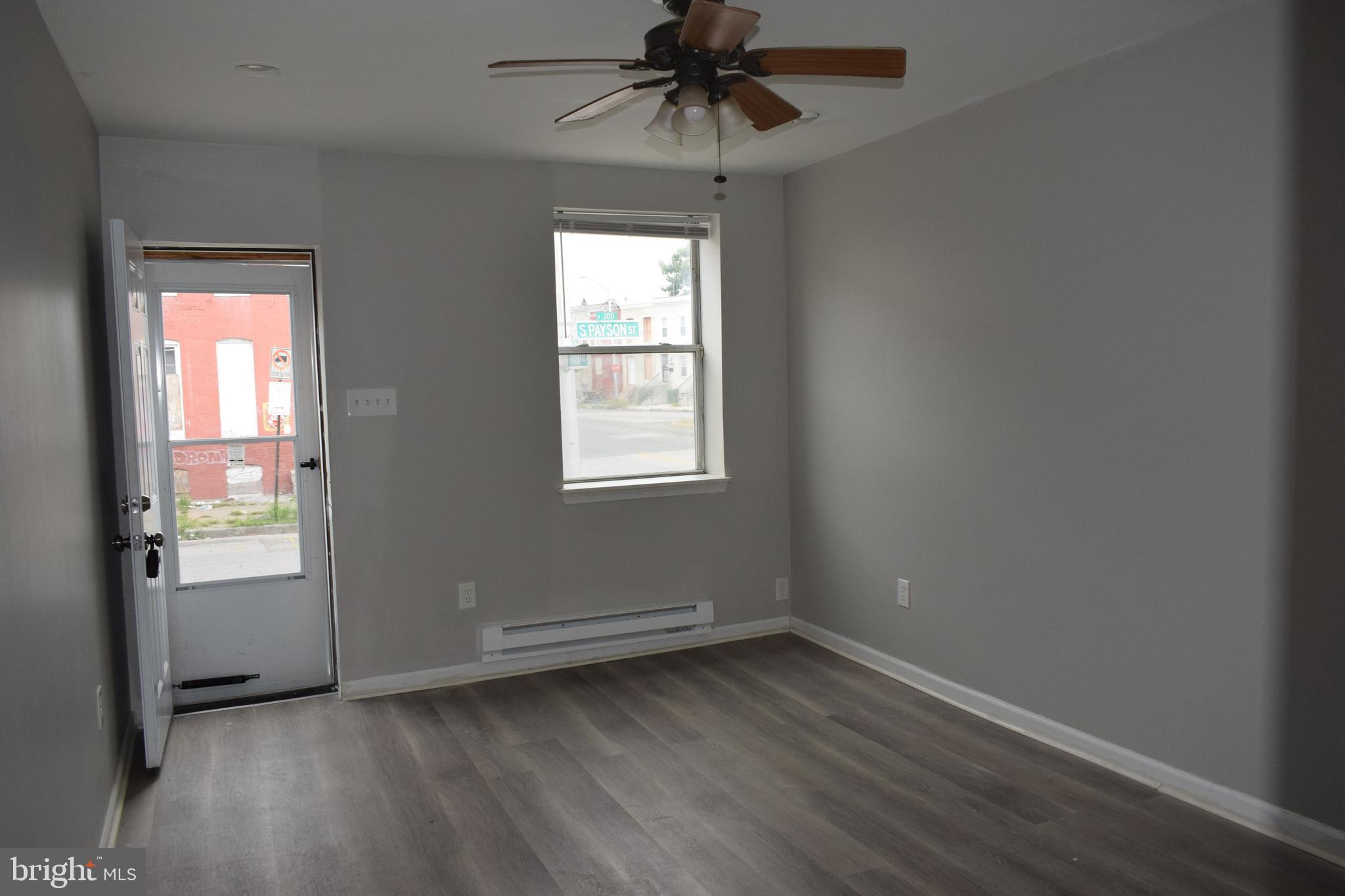 346 South Payson Street Baltimore, MD 21223 - Photo 17 of 29 an empty room that has a window