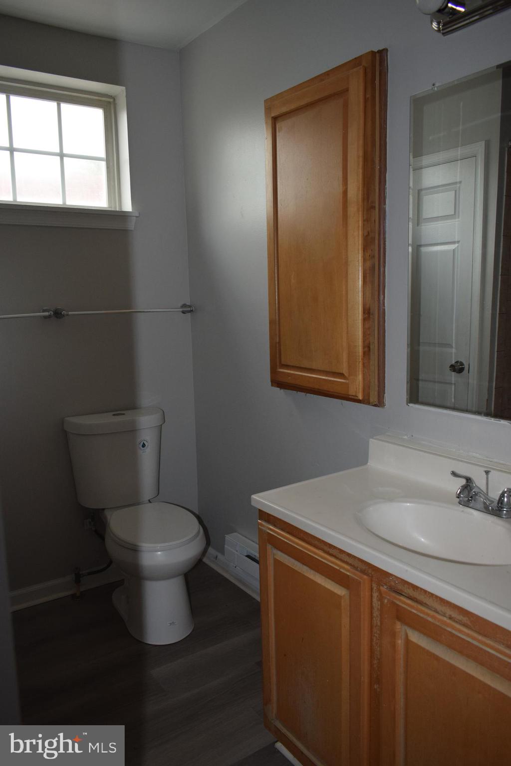 346 South Payson Street Baltimore, MD 21223 - Photo 23 of 29 a bathroom with a sink and a toilet