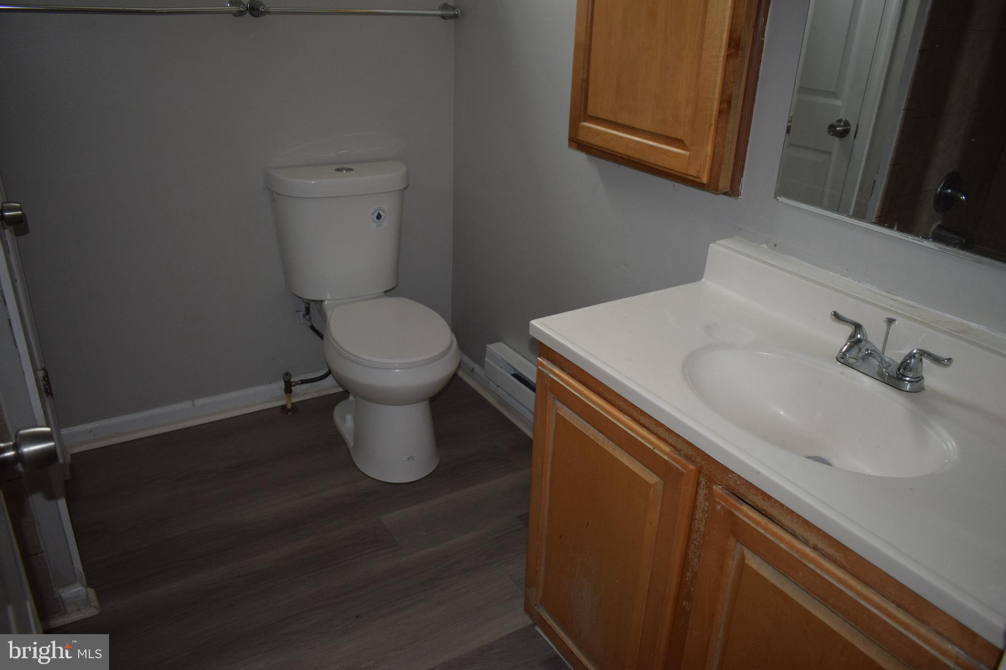346 South Payson Street Baltimore, MD 21223 - Photo 27 of 29 a bathroom with a sink and a toilet
