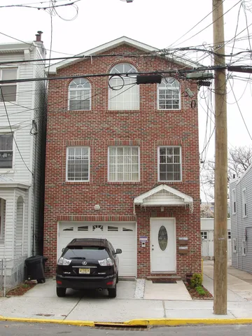 a car parked in front of a house