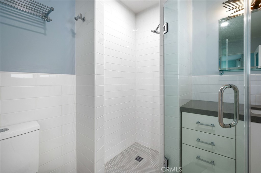 72543 Beavertail Street Palm Desert, CA 92260 - Photo 22 of 45 a bathroom with a shower toilet and sink