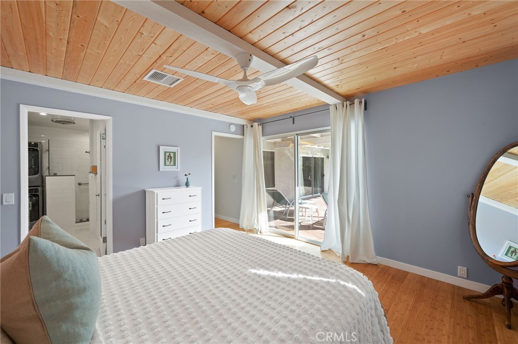 72543 Beavertail Street Palm Desert, CA 92260 - Photo 27 of 45 a bedroom with a bed and glass door