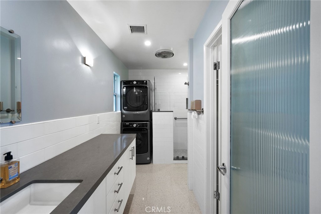 72543 Beavertail Street Palm Desert, CA 92260 - Photo 28 of 45 a kitchen with a refrigerator and a sink
