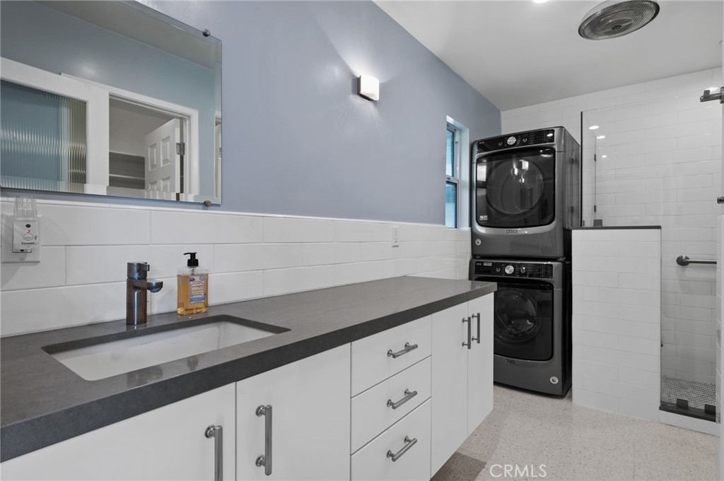 72543 Beavertail Street Palm Desert, CA 92260 - Photo 29 of 45 a kitchen with granite countertop a sink and cabinets