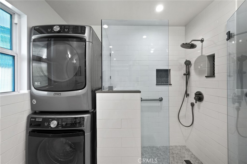 72543 Beavertail Street Palm Desert, CA 92260 - Photo 31 of 45 a bathroom with a granite countertop shower a mirror and a sink