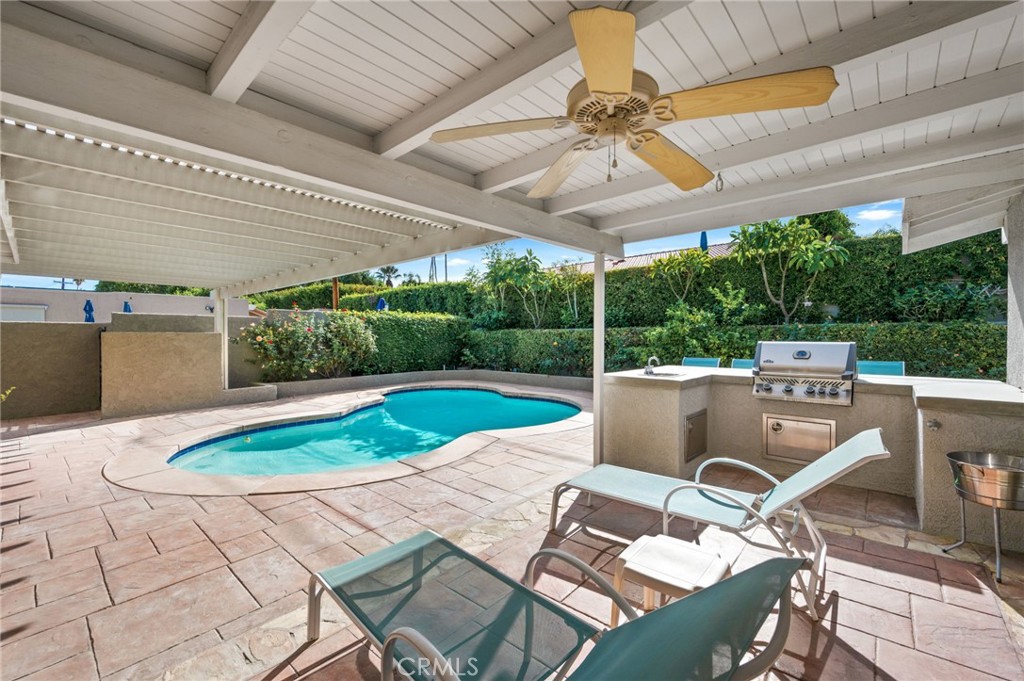 72543 Beavertail Street Palm Desert, CA 92260 - Photo 34 of 45 a view of a patio with a table and chairs