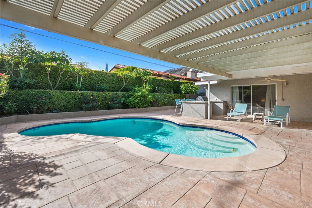 72543 Beavertail Street Palm Desert, CA 92260 - Photo 36 of 45 a view of a swimming pool with a patio