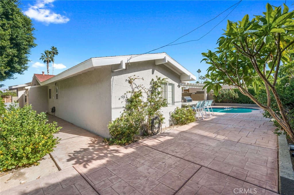 72543 Beavertail Street Palm Desert, CA 92260 - Photo 40 of 45 a front view of a house with garden